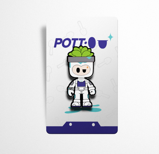 A high-quality enamel pin of the “Pott•o” character, displayed on a branded card backing with the name “Pott•o” prominently featured. The card design includes a subtle shovel motif in the background, tying into the character’s gardening theme.