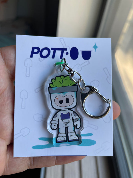 Keychain with a character design on a POTT-O branded card